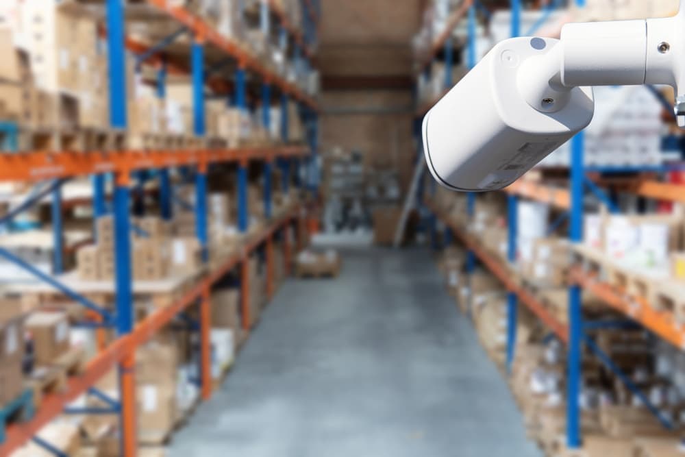 camera focused on an aisle in a warehouse