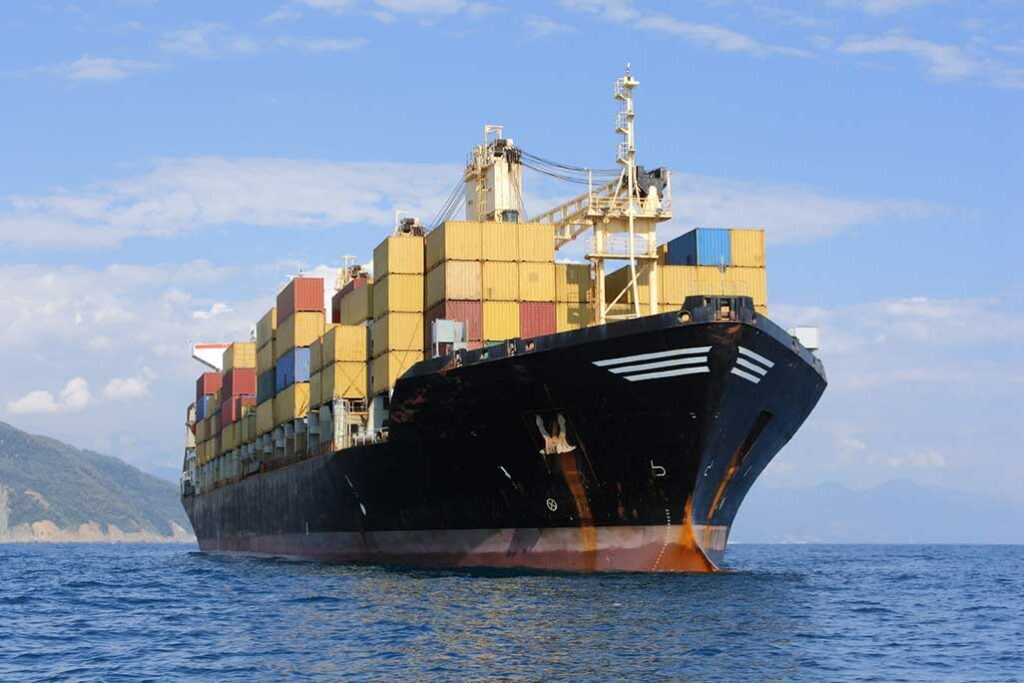 cargo ship loaded with stacks of containers